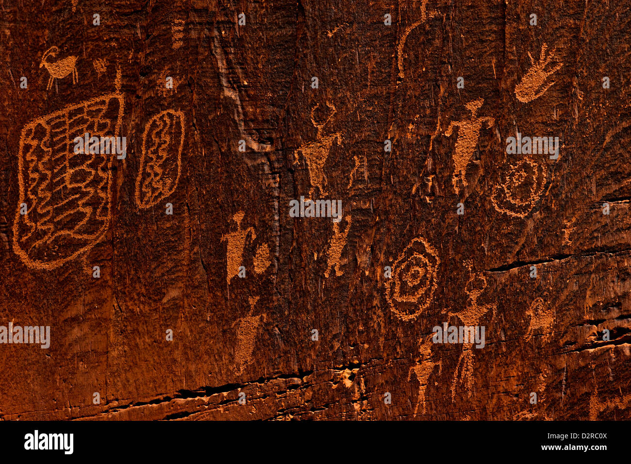 Horned anthropomorphs holding shields, Formative Period Petroglyphs, Utah Scenic Byway 279, Potash Road, Moab, Utah, USA Stock Photo