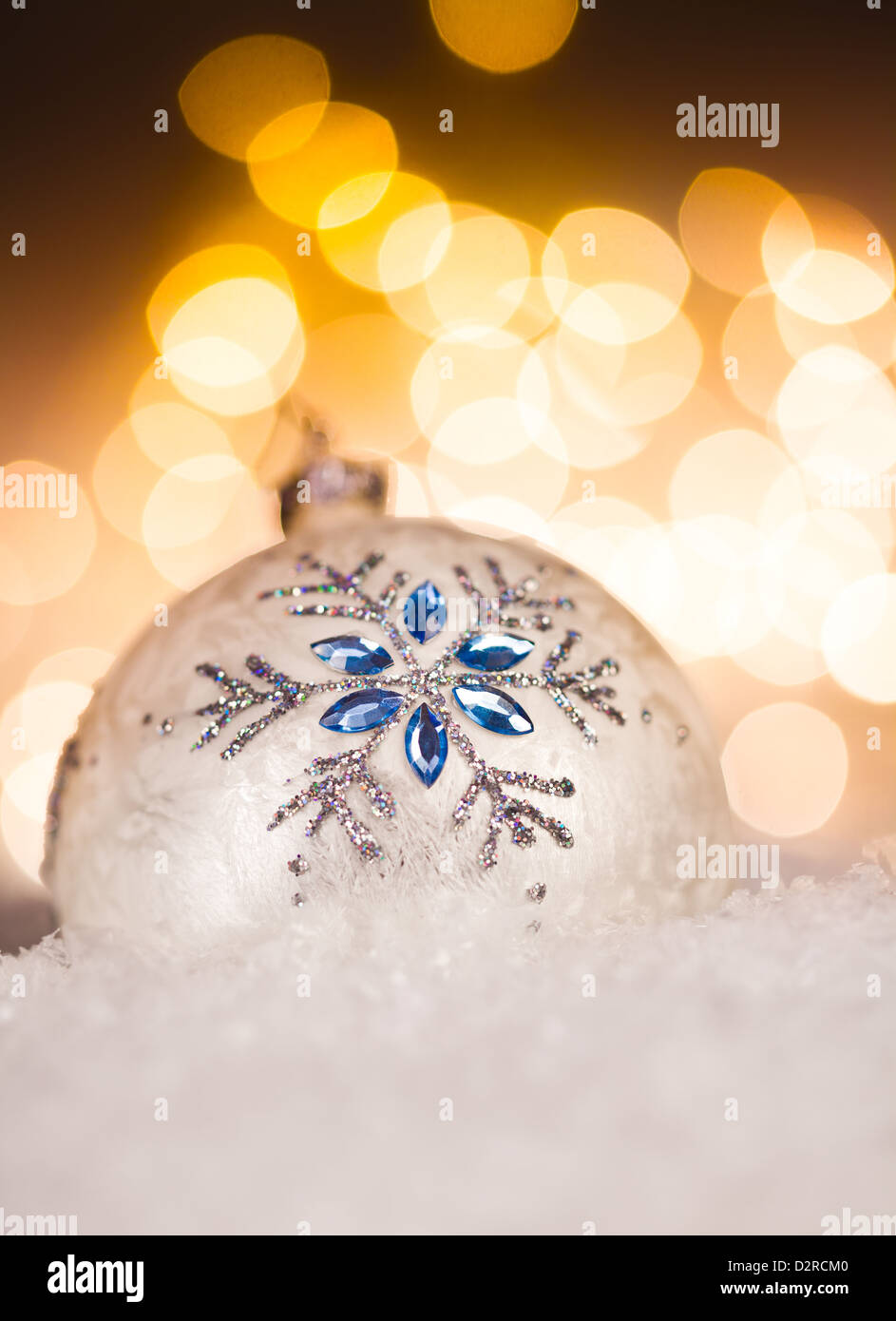 Christmas ball with Golden Holiday Background Stock Photo - Alamy