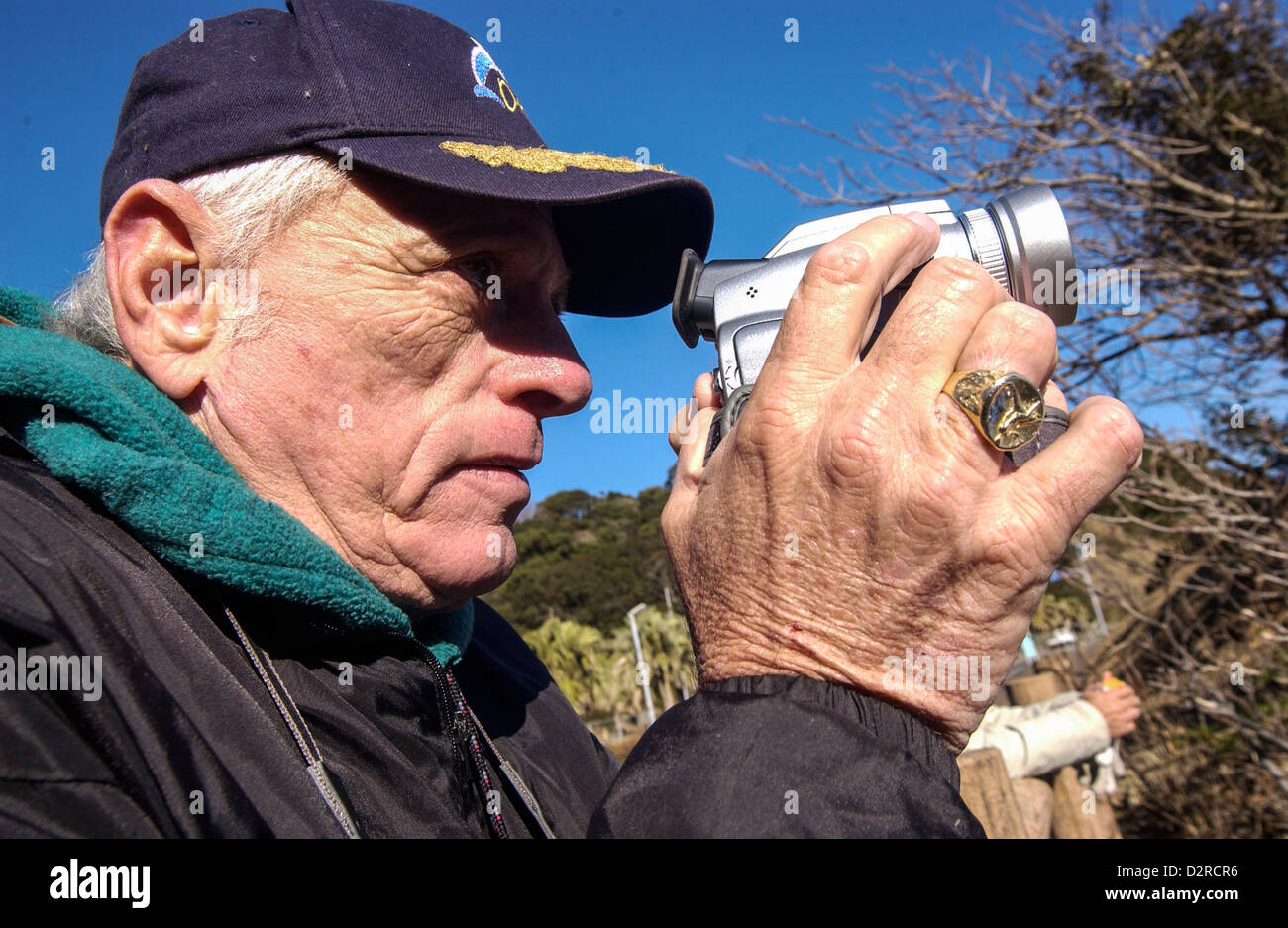 Ex dolphin trainer and activist Ric O'Barry taking video footage at the cove in Taiji, Wakayama, Japan Stock Photo