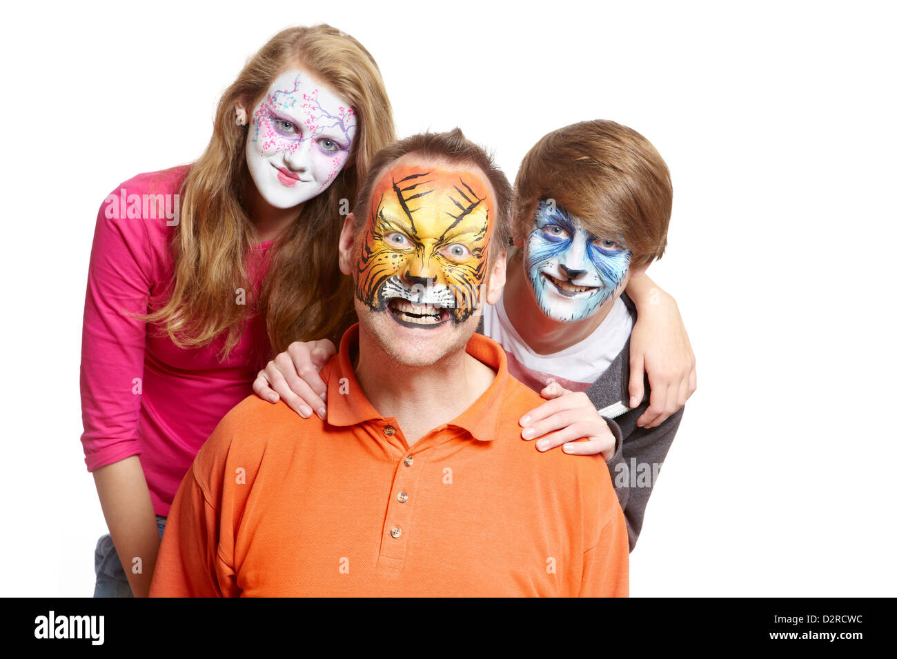 Group of people with face painting geisha girl wolf and tiger smiling on white background Stock Photo