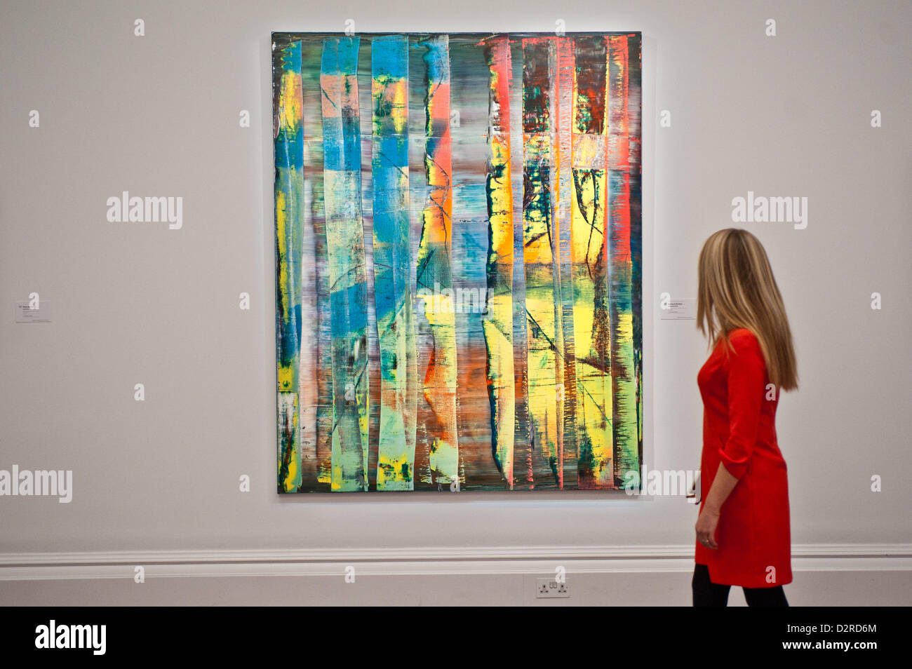 London, UK. 31 January 2013.  A Sotheby's employee poses in front of a painting entitled 'Abstraktes Bild (769-1)' by Gerhard Richter (Est £ 7.5-9.5 million) during the press preview of the Sotheby's forthcoming February sales of Impressionist & Modern Art and Contemporary Art in London, including works by Picasso, Bacon, Monet, Richter, Miró, Basquiat. Credit:  pcruciatti / Alamy Live News Stock Photo
