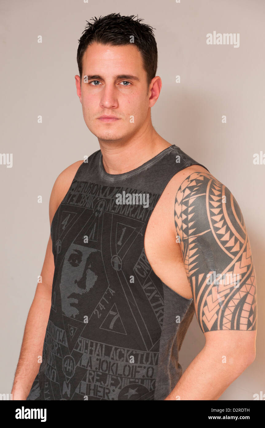 Attractive handsome hunky young man in singlet vest. Stock Photo
