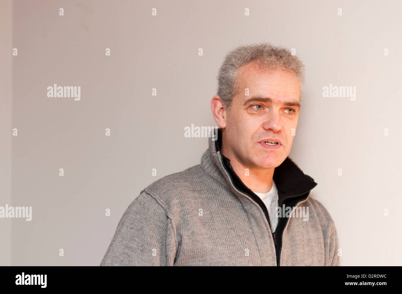 Casual portrait of middle aged man with grey hair Stock Photo - Alamy