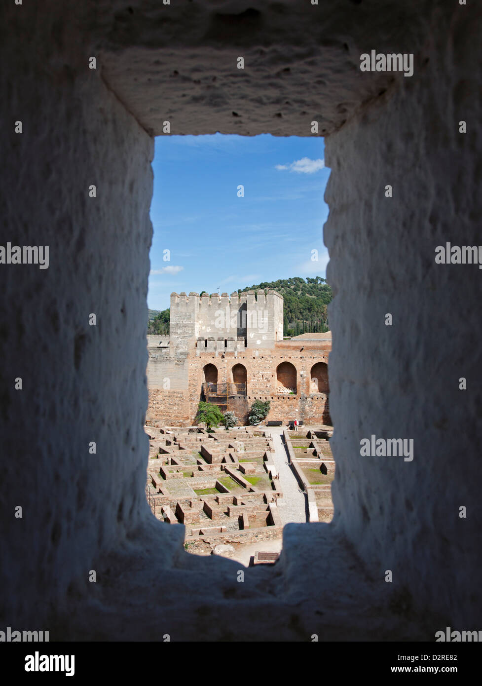 A view through a thickset window in the Torre de la Vela of the old Alcazaba in the Alhambra complex at Granada Andalucia Spain Stock Photo
