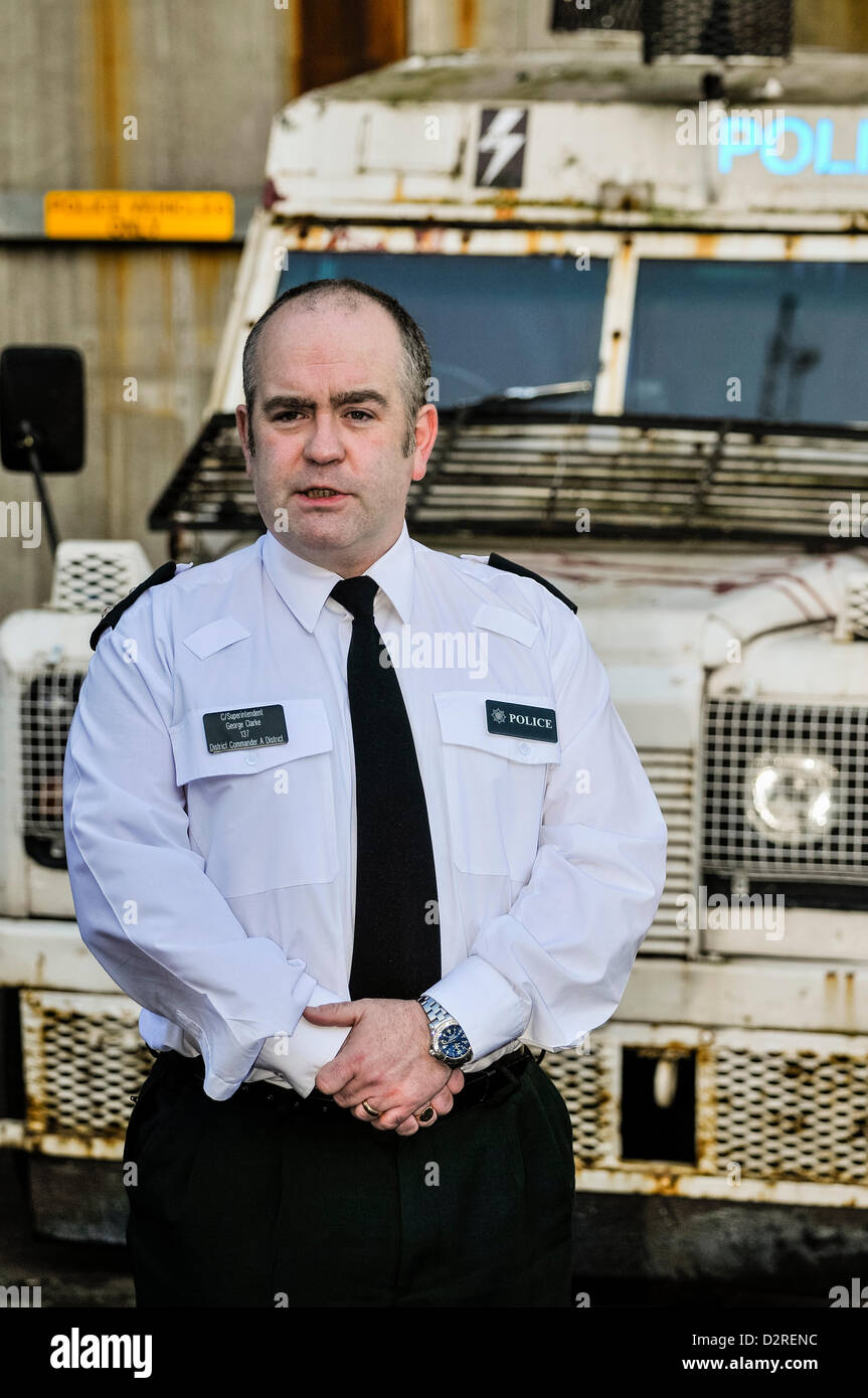 31st January 2013, Belfast, Northern Ireland. PSNI Chief Superintendant George Clarke, District Commander of A District (North and West Belfast) stands in front of an armoured PSNI Police Landrover. Stock Photo