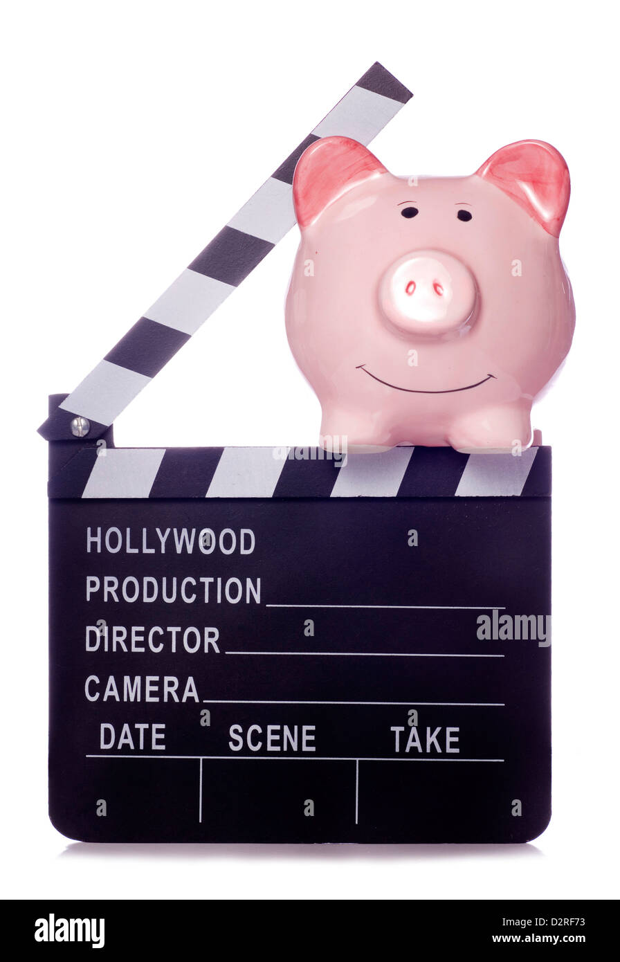 Piggy bank with film clapper board studio cutout Stock Photo