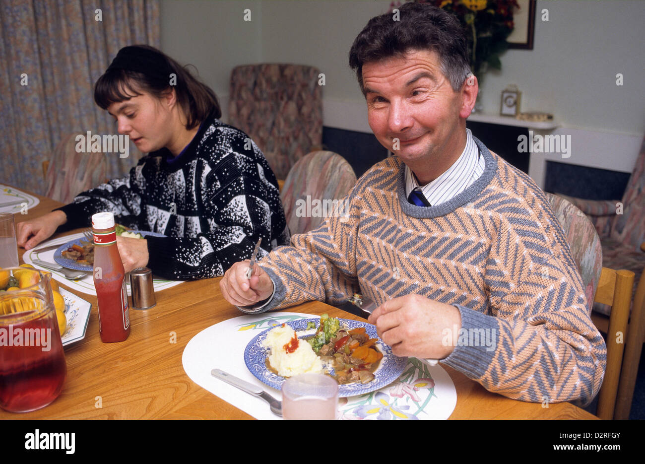 Disabled person eating a meal Stock Photo Alamy