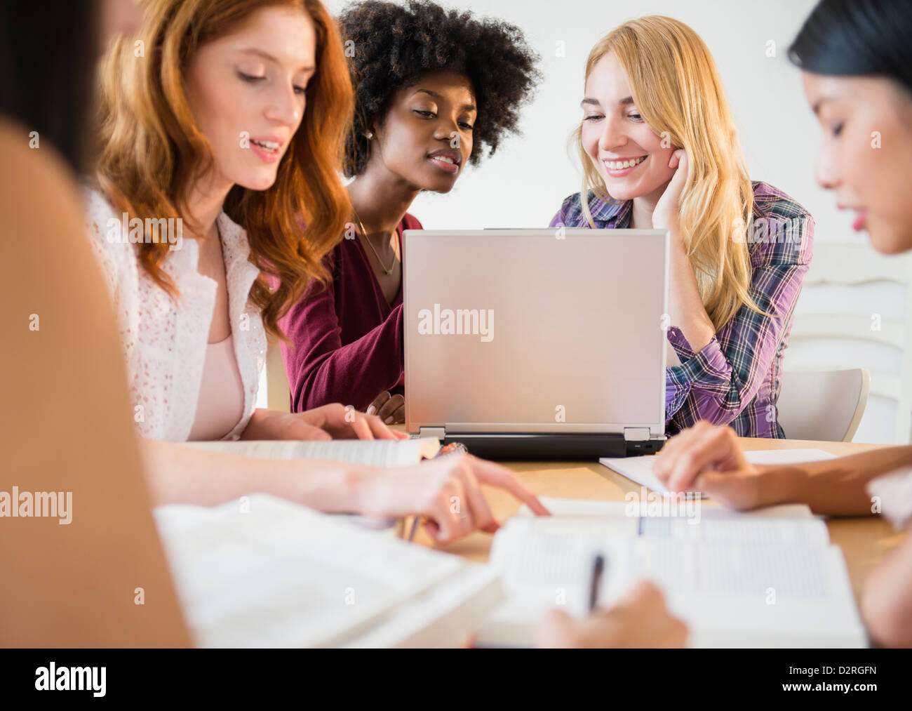 Businesswomen working together in meeting Stock Photo