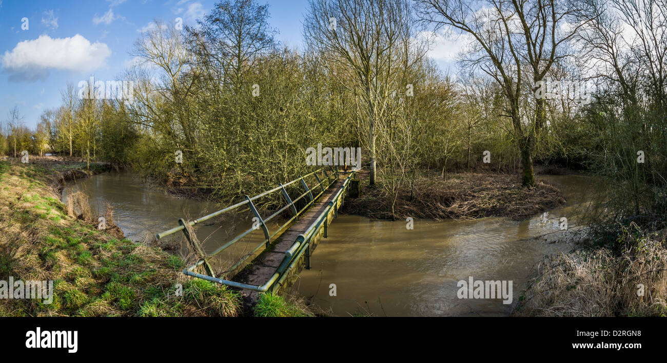 Footbridge over the River Itchen part of the Millennium Way, Warwickshire, England, UK Stock Photo