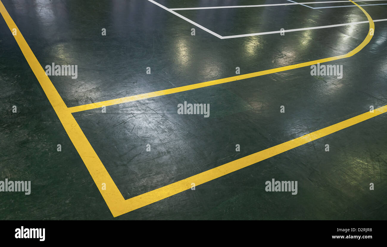 Green floor of sports hall with marking lines Stock Photo