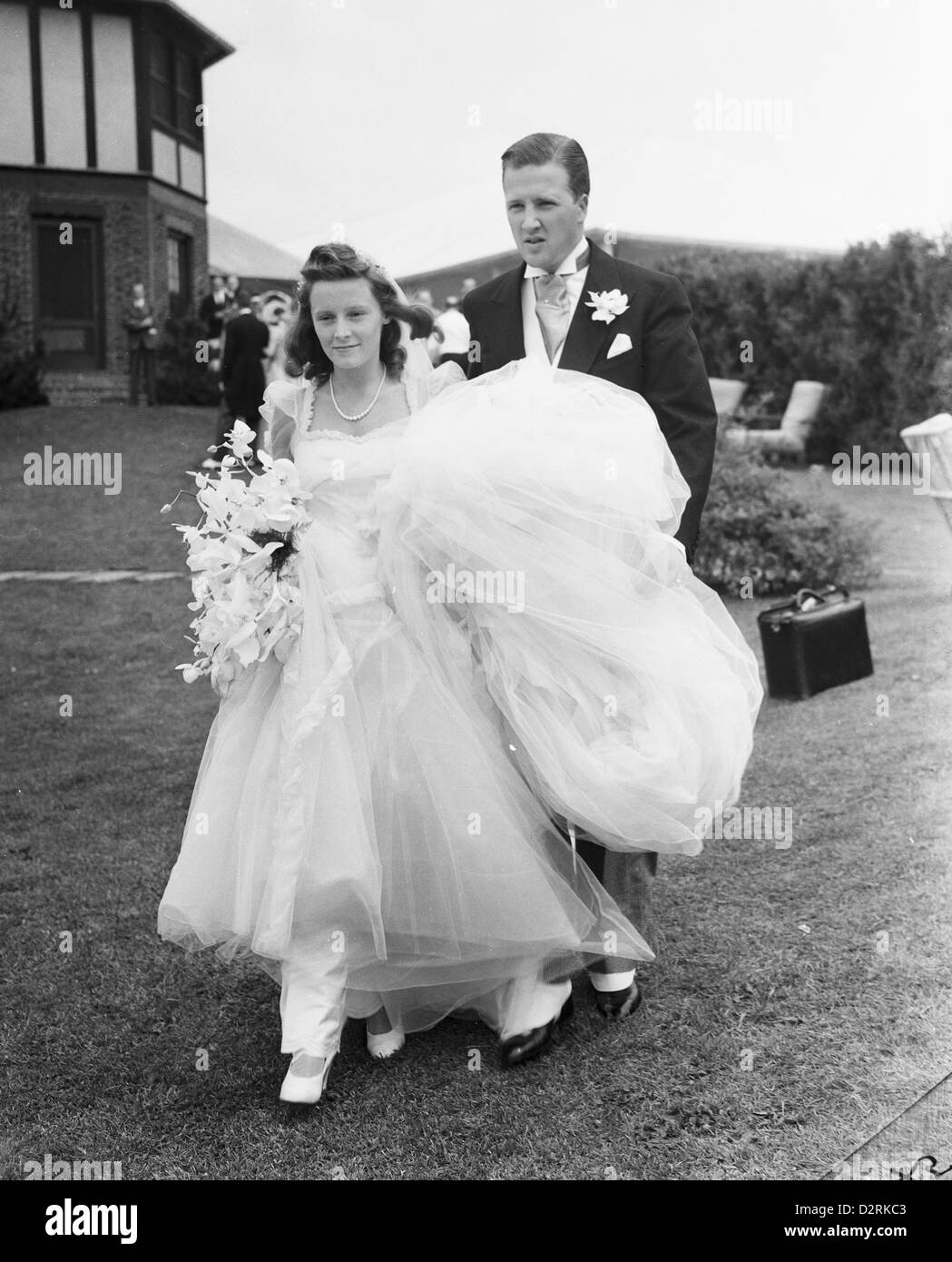 Mr & Mrs Henry Ford II at their wedding, Southampton, New York, July 13,1940 by Bert Morgan Stock Photo