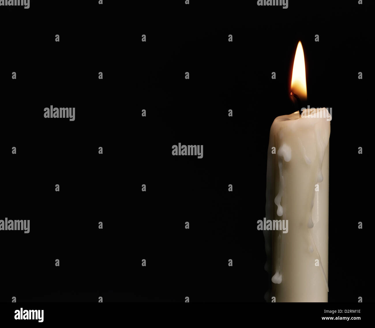 Pillar wax candle burning on white background Stock Photo - Alamy