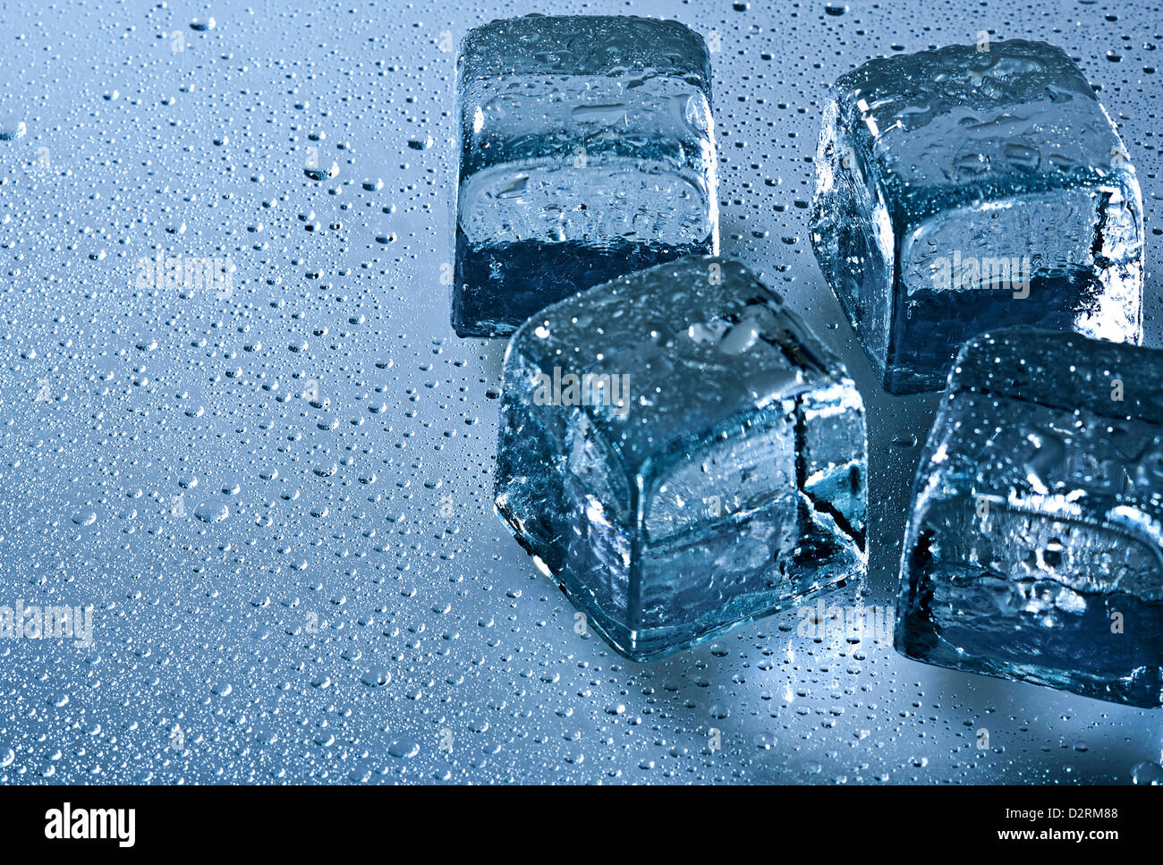 Ice cube and water drops on the wet background Stock Photo - Alamy