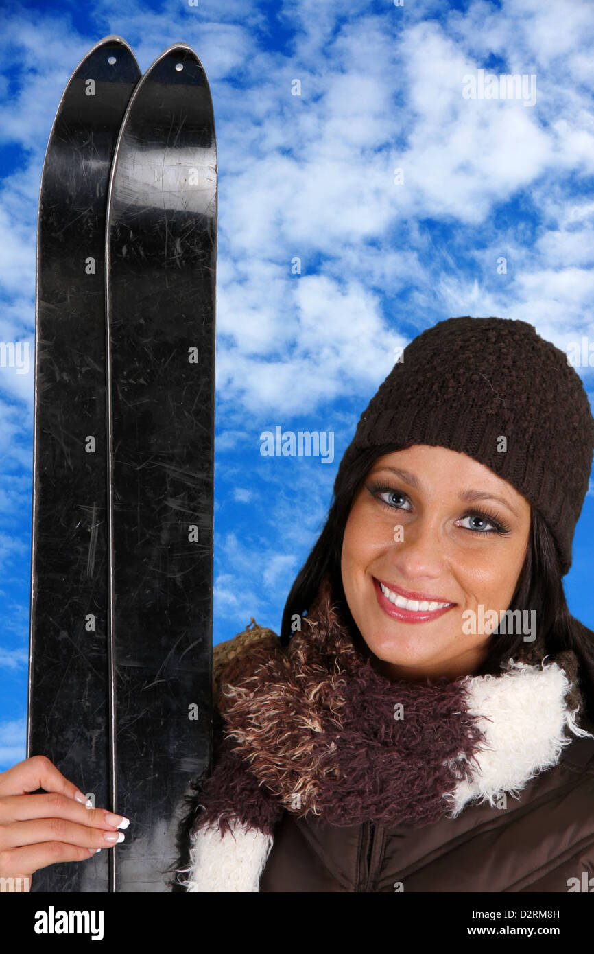 Woman with skis on the mountain in the winter Stock Photo - Alamy