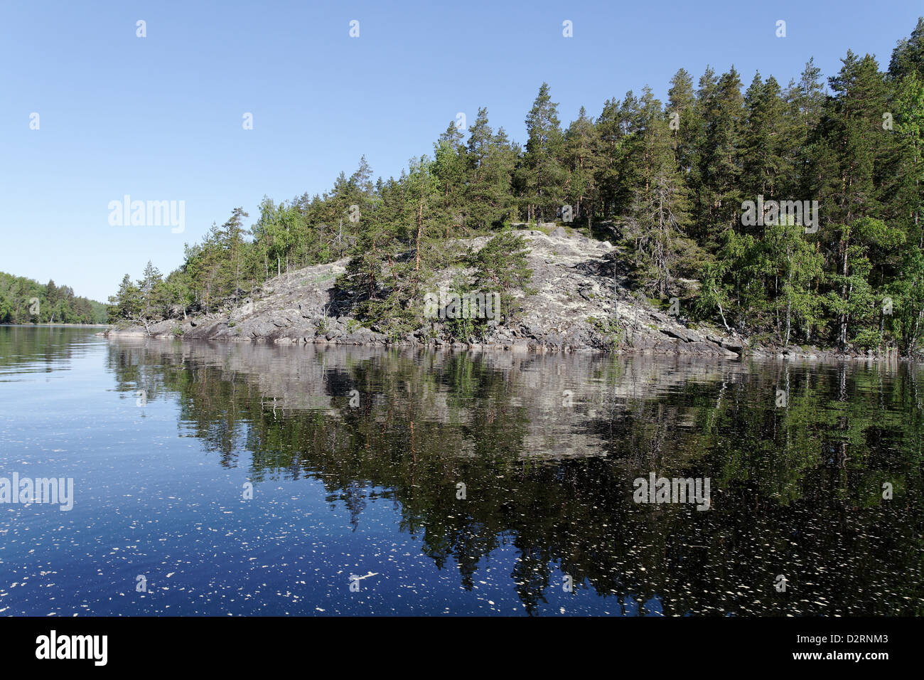 Reflected island in Lake Haukivesi, Linnansaari National Park, Finland Stock Photo