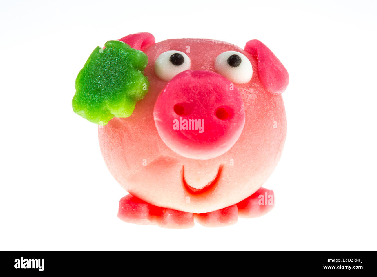 Little marzipan pigs, pork face, with shamrock, lucky charm symbol. Stock Photo