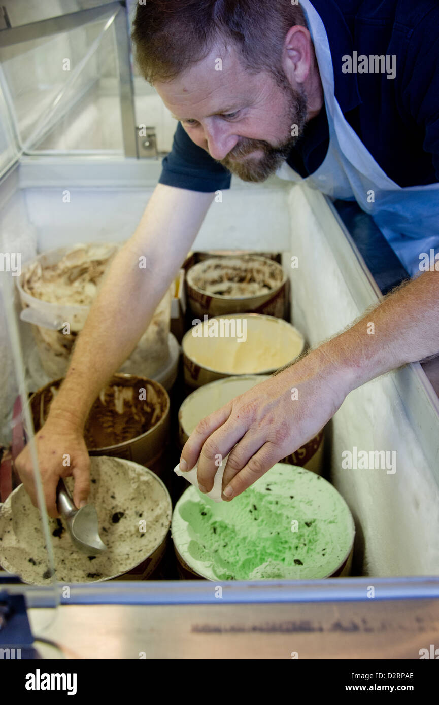 Man scooping ice cream Stock Photo - Alamy