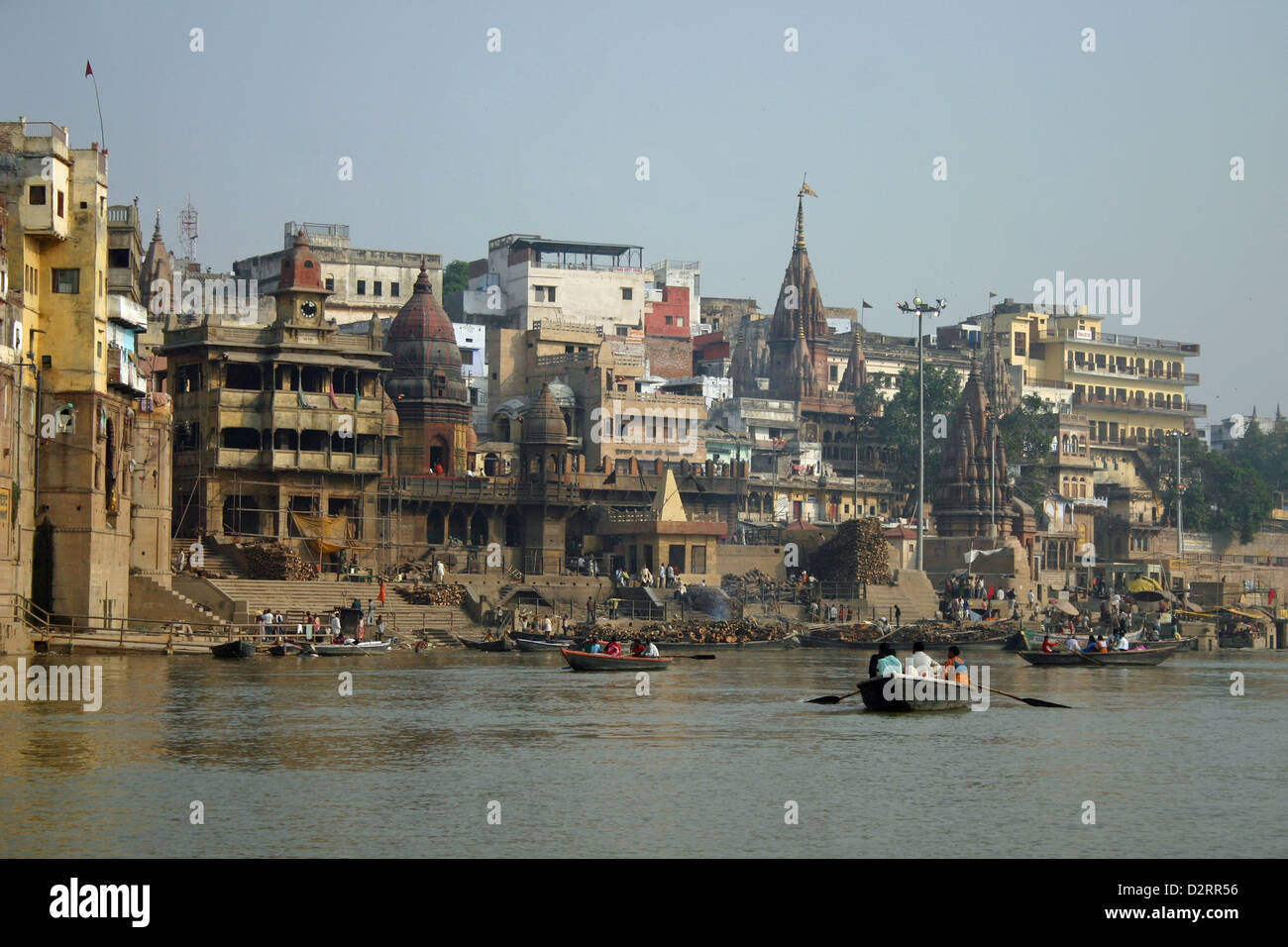 Ghats in Varanasi are riverfront steps leading to the banks of the River Ganges. The city has 88 ghats. Most of the ghats are bathing and puja ceremony ghats, while two ghats are used exclusively as cremation sites. Most Varanasi ghats were rebuilt after 1700 AD, when the city was part of Maratha Empire. The patrons of current ghats are Marathas, Shindes (Scindias), Holkars, Bhonsles, and Peshwes (Peshwas). Many ghats are associated with legends or mythologies while many ghats are privately owned. Morning boat ride on the Ganges across the ghats is a popular visitors attraction. Stock Photo