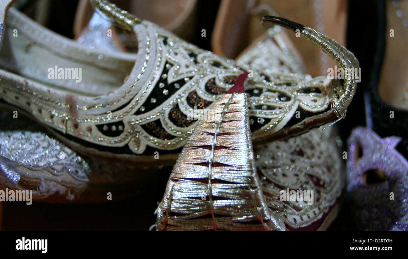 Shiny shoes and decorated fine-tipped upwards, are souvenirs in the markets of Turkey Stock Photo