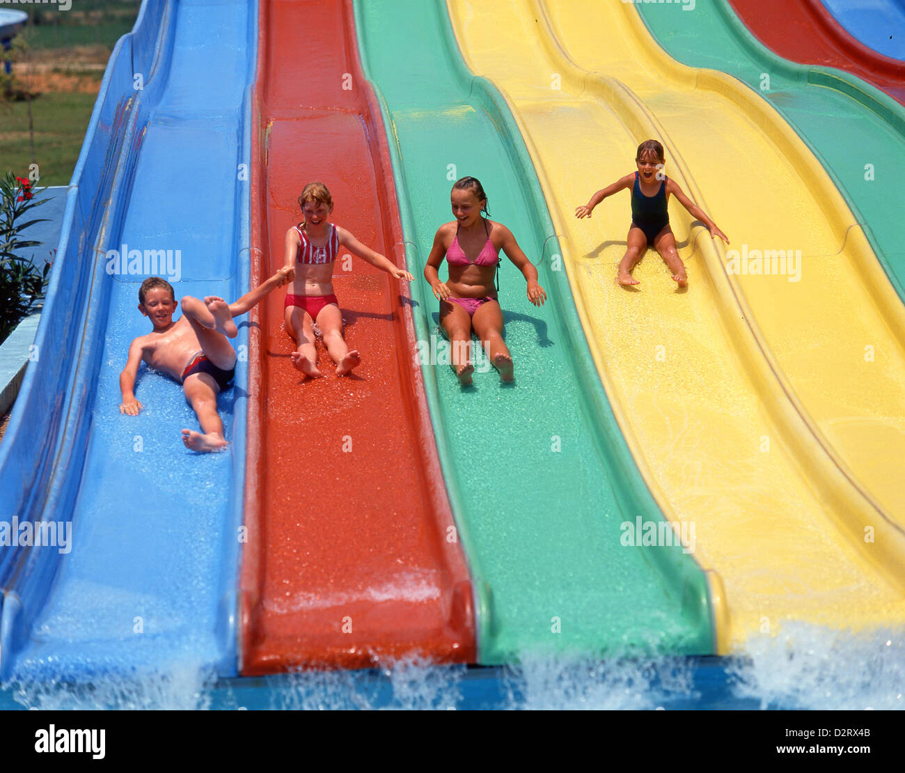 Family on waterslide, Aquamar Water Park, Platja d’en Bossa, Ibiza, Balearic Islands, Spain Stock Photo