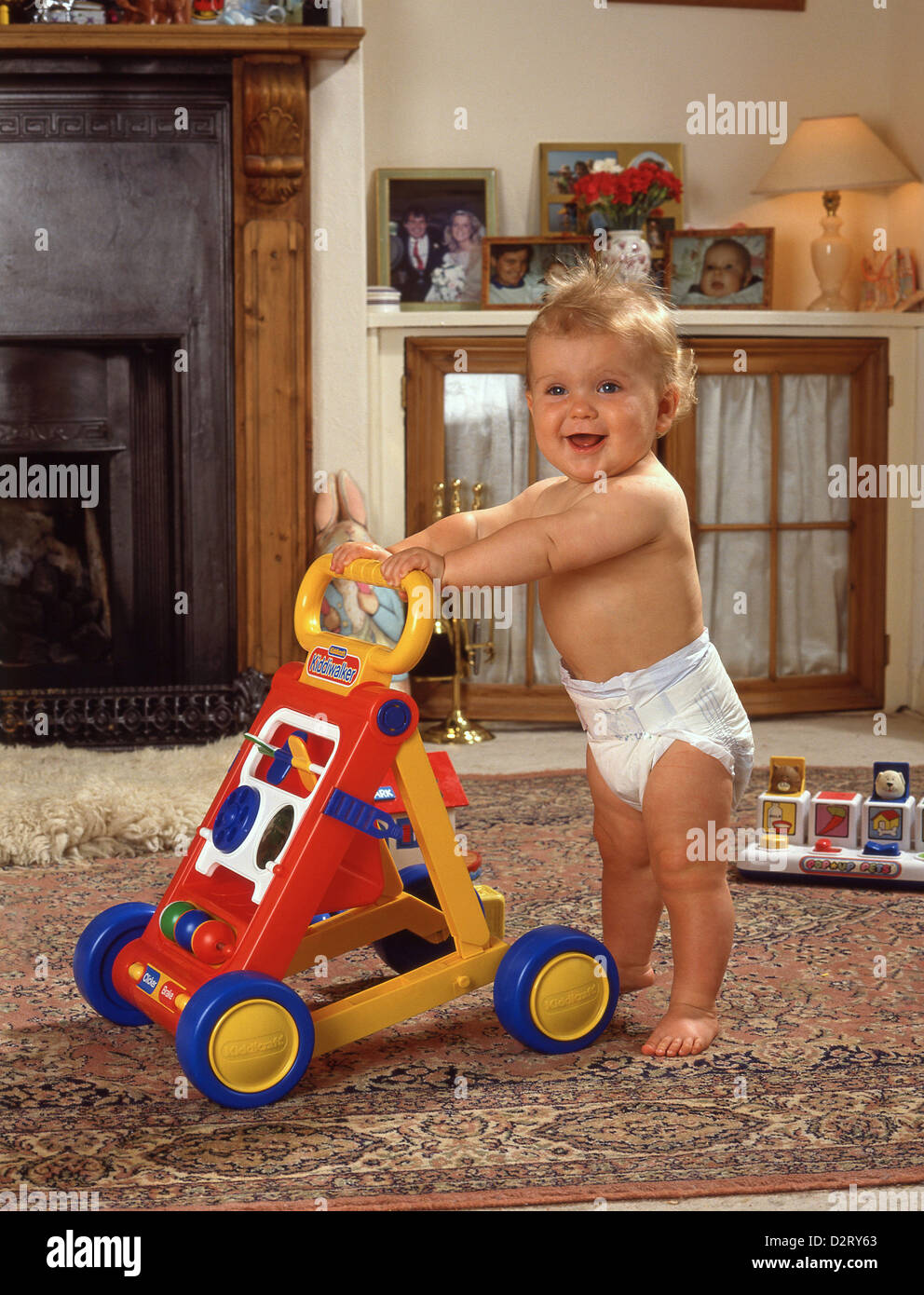 Young male toddler learning to walk, Winkfield, Berkshire, England, United Kingdom Stock Photo
