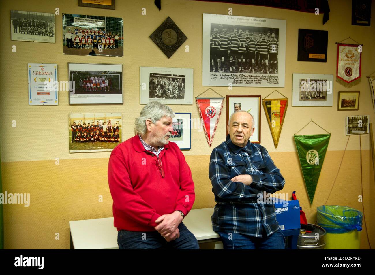 Heinz-Dietrich Kraschewski (L) and Dieter Kaehne, one of the eldest members of the club BFC Germania 1888, stands in the clubhouse in front of the collection of pictures and pennants in Berlin, Germany, 29 January 2013. Photo: Marc Tirl Stock Photo