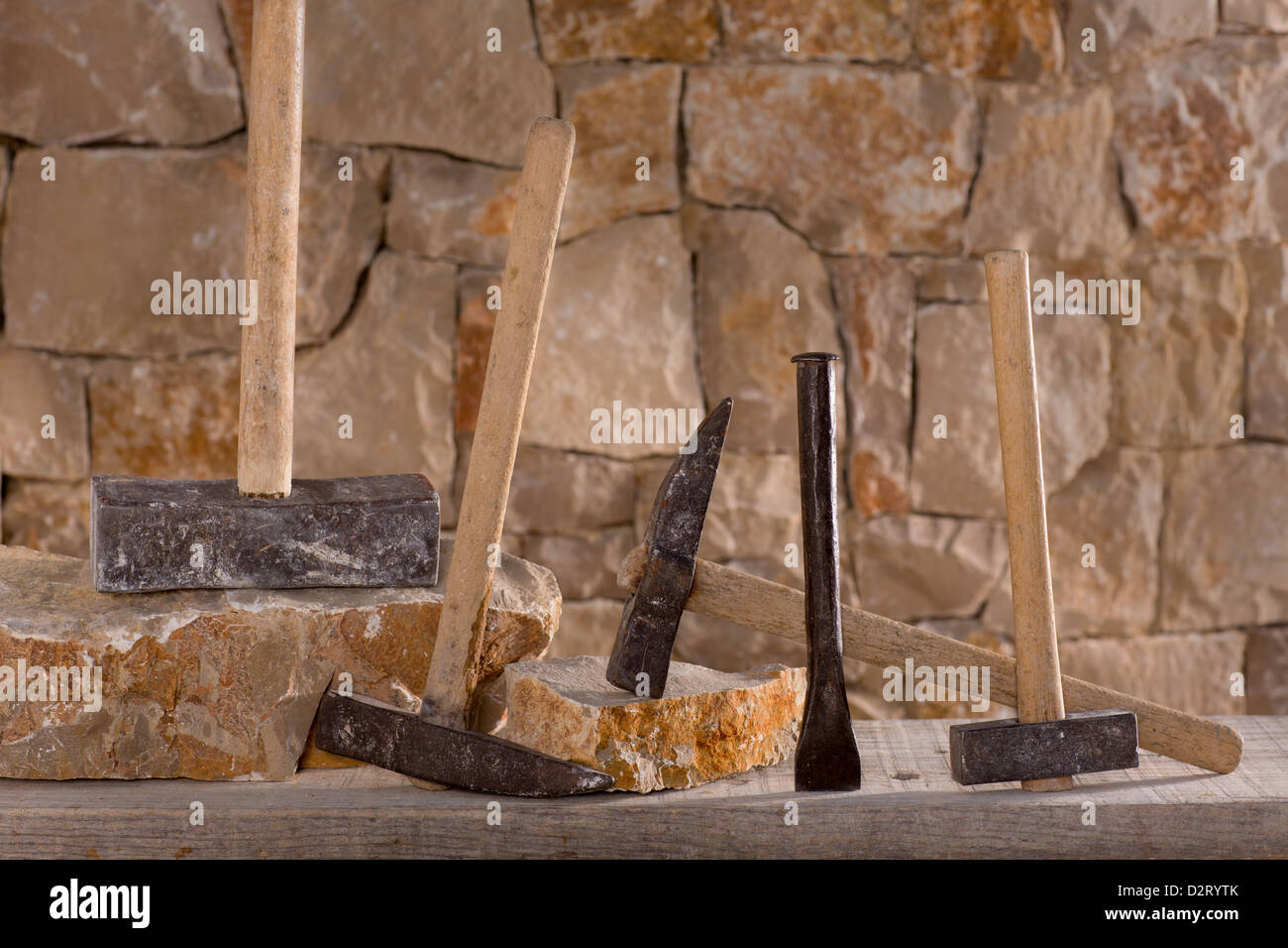 Hammer mason tools of stonecutter masonry work in a contruction stone