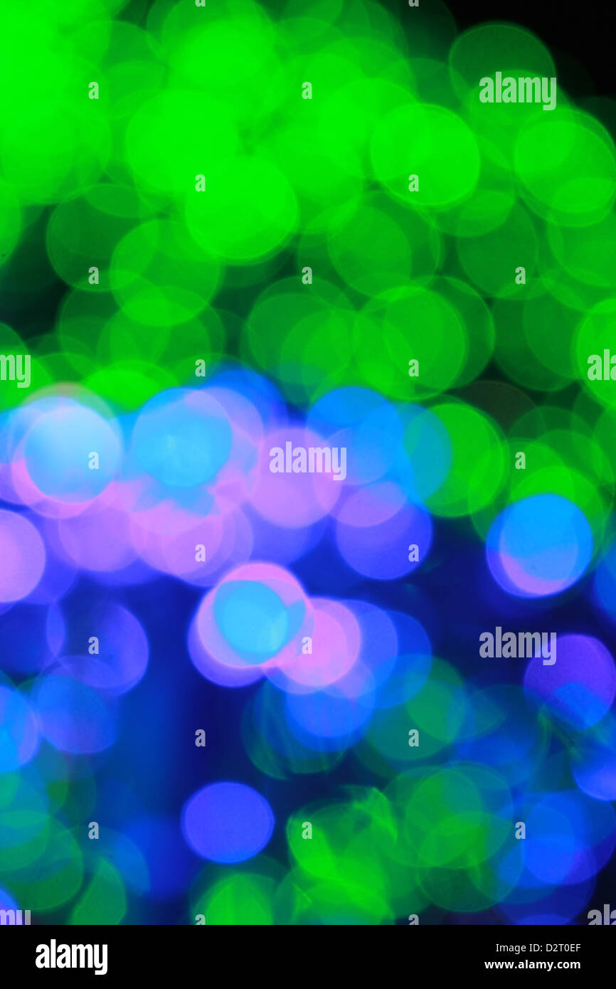 Abstract defocused lights bokeh vertical background blue and green colors Stock Photo