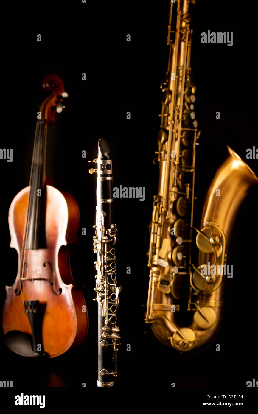 Music Sax tenor saxophone violin and in black background Stock