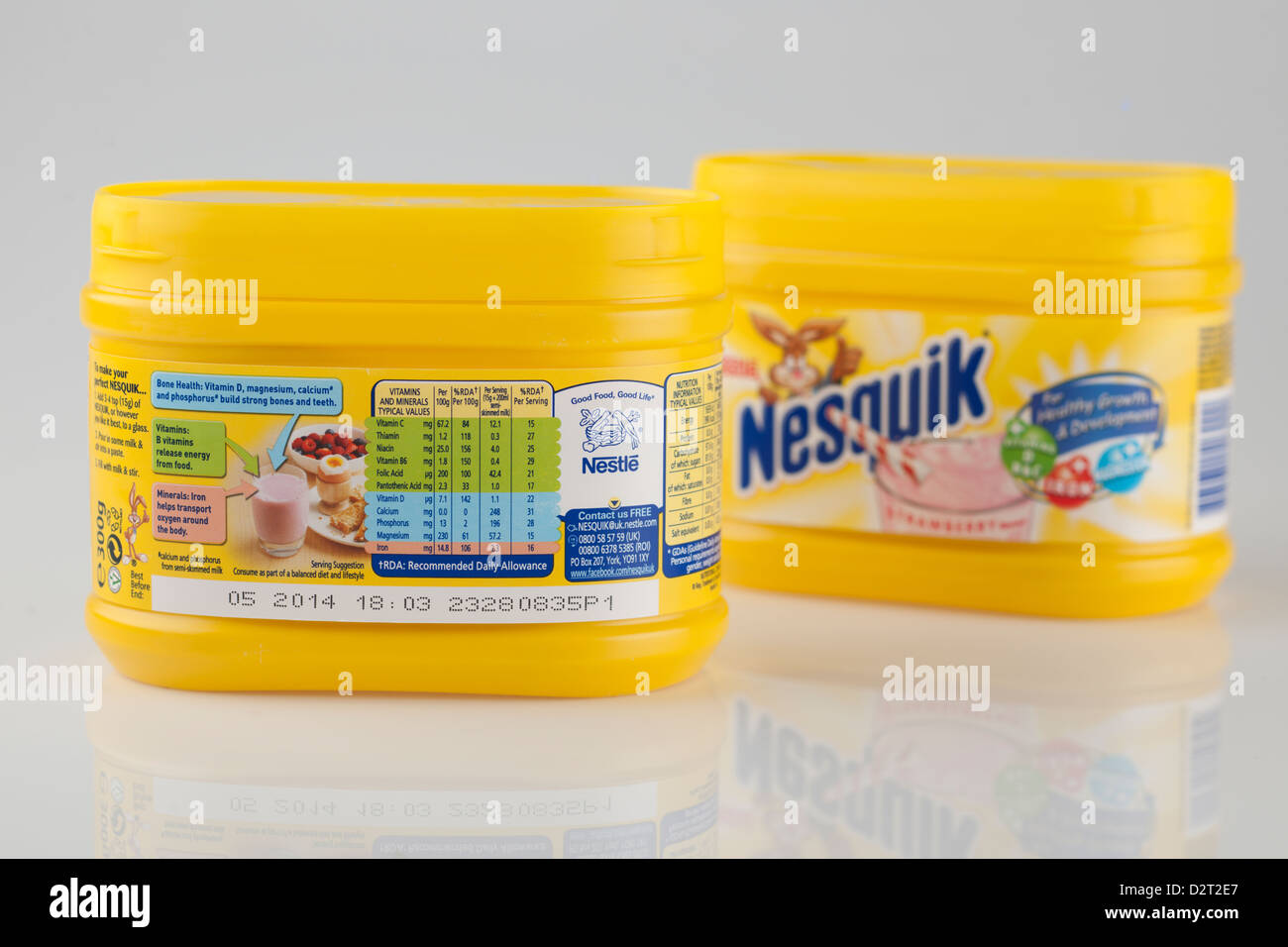 Two containers of Nestle Strawberry flavour Nesquick milkshake mix