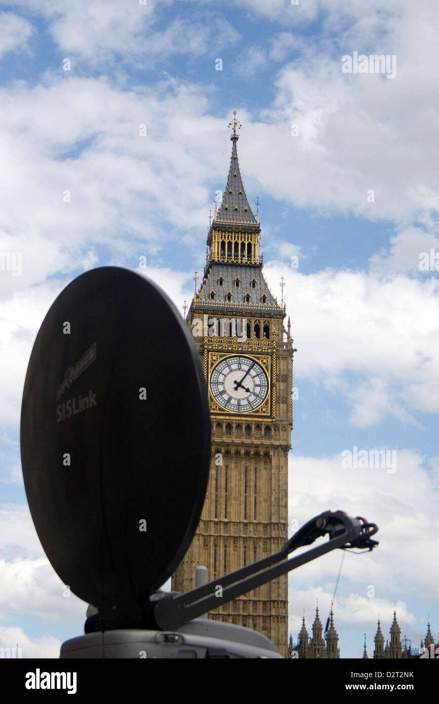 A media van with a large satellite dish waiting outside the Houses of Parliament in central London. Stock Photo