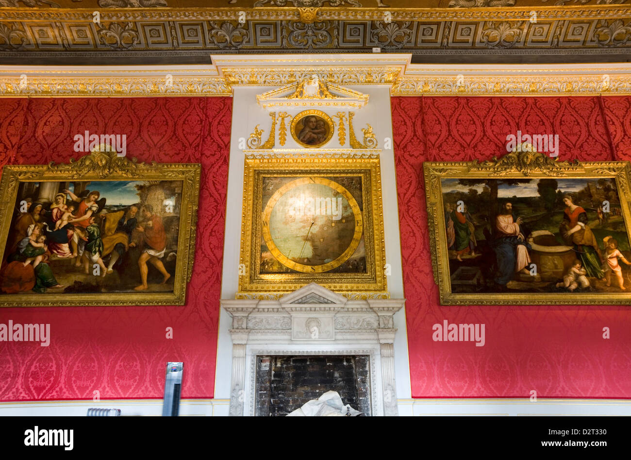 Wall, with chimney piece, paintings and anemometer, in the The Kings Gallery of Kensington Palace, London. UK. Stock Photo