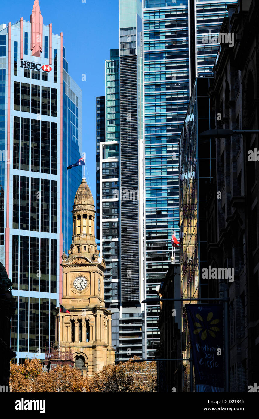 Contrasts between traditional sandstone architecture of Sydney's Town Hall and the modern skyscrapers behind. Sydney, Australia. Stock Photo