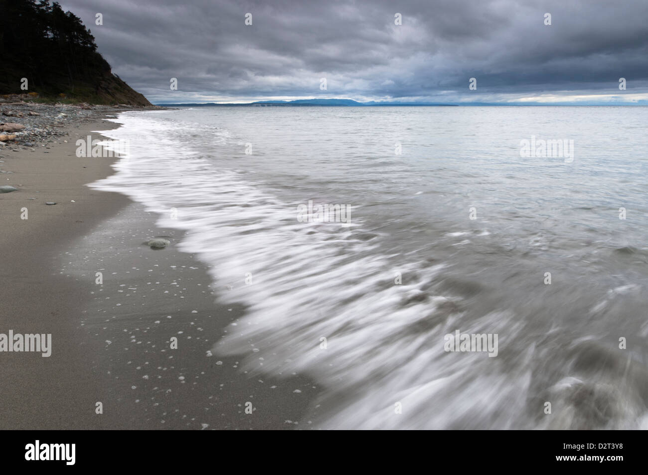 Waves wash up on the beach at Fort Ebey State Park, Whidbey Island, Washington, USA Stock Photo