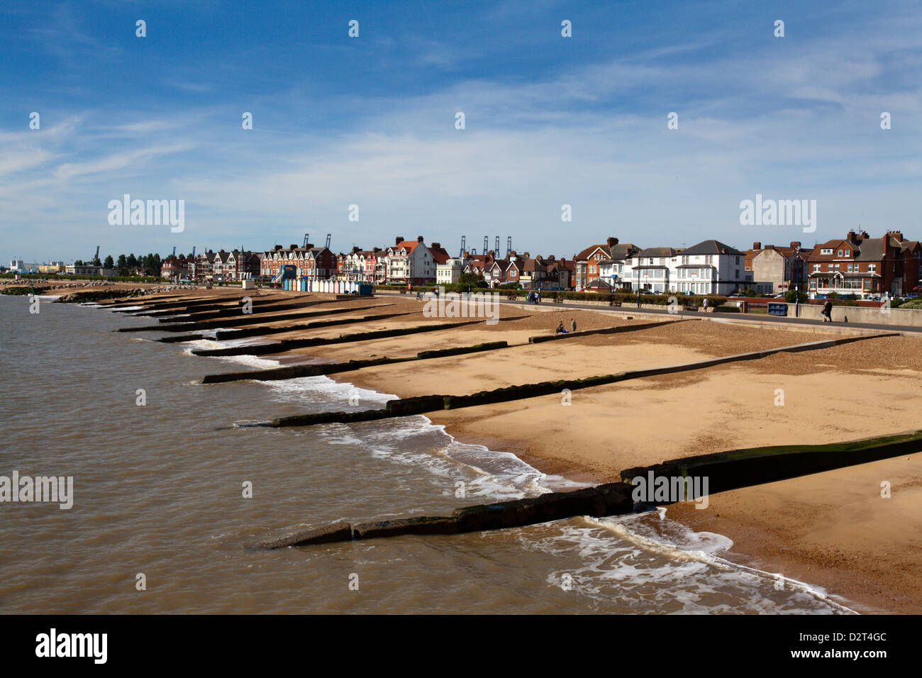 Felixstowe Beach from the pier with Container Port cranes in the distance, Felixstowe, Suffolk, England, United Kingdom, Europe Stock Photo