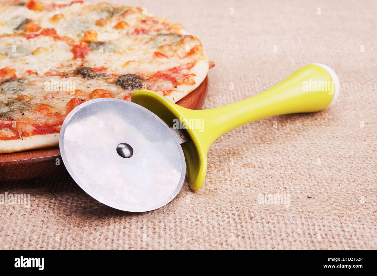 Pizza mozzarella with a knife on the table Stock Photo