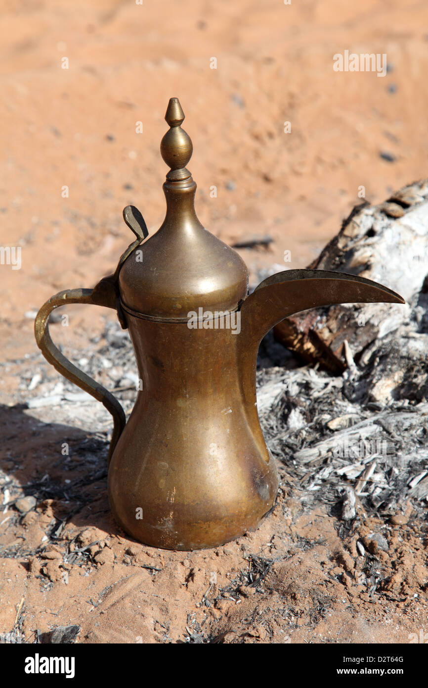 Arabic coffee pot at a fireplace in the desert. Abu Dhabi, United Arab