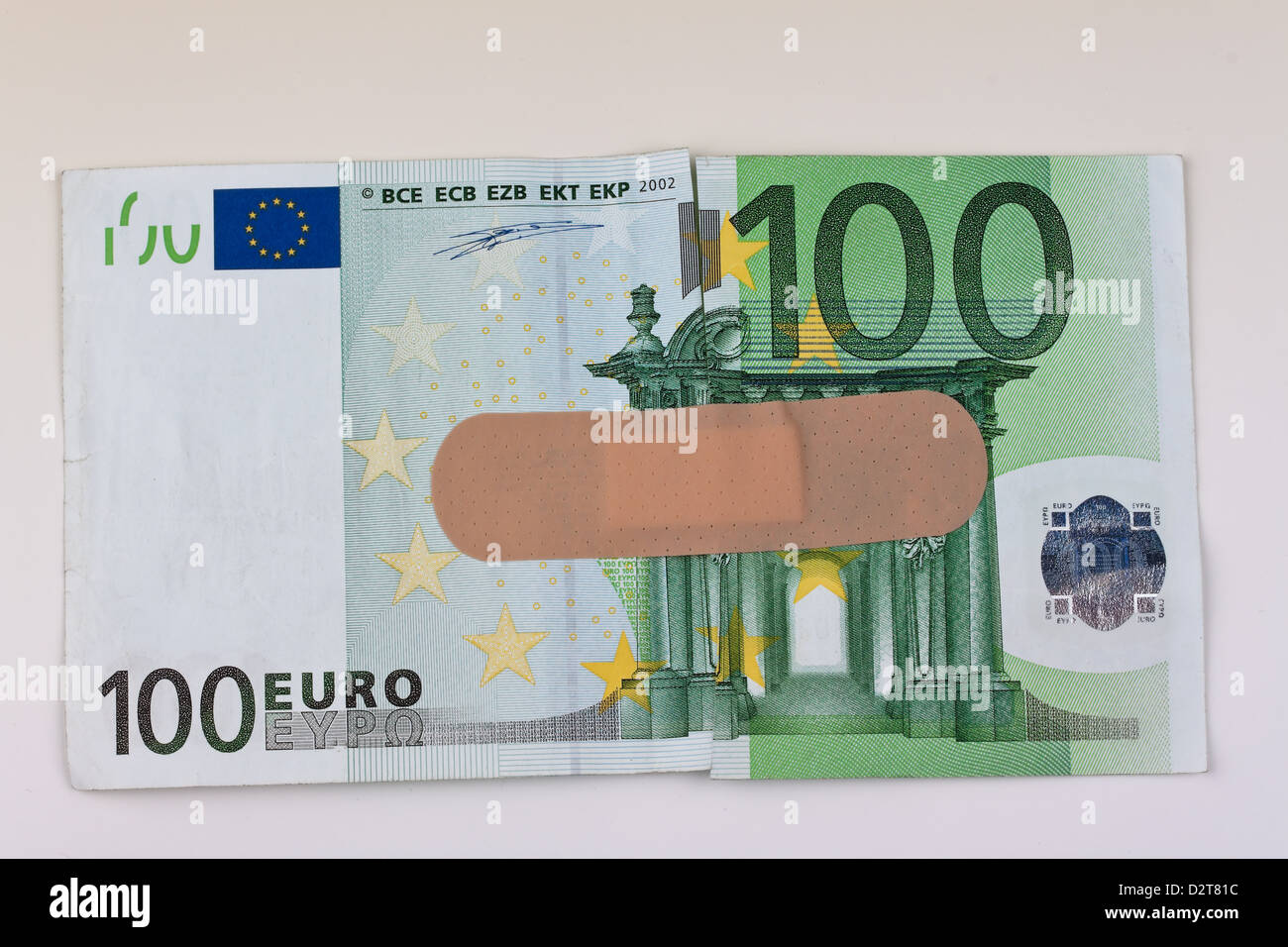 Euro banknotes with a band-aid Stock Photo