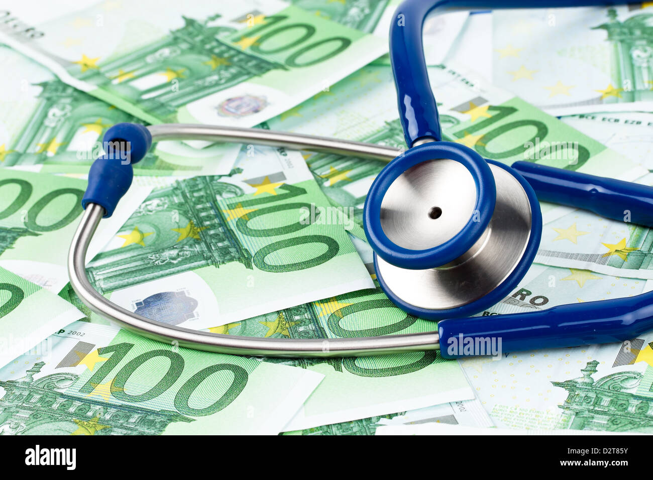Many Euro bank notes with a stethoscope. Health costs. Stock Photo