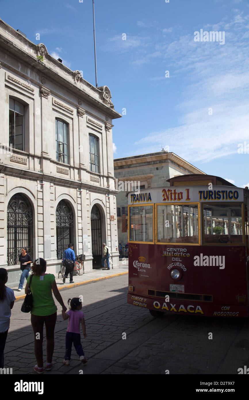 Street in Oaxaca with Local Tour Tram Bus - Mexico Stock Photo