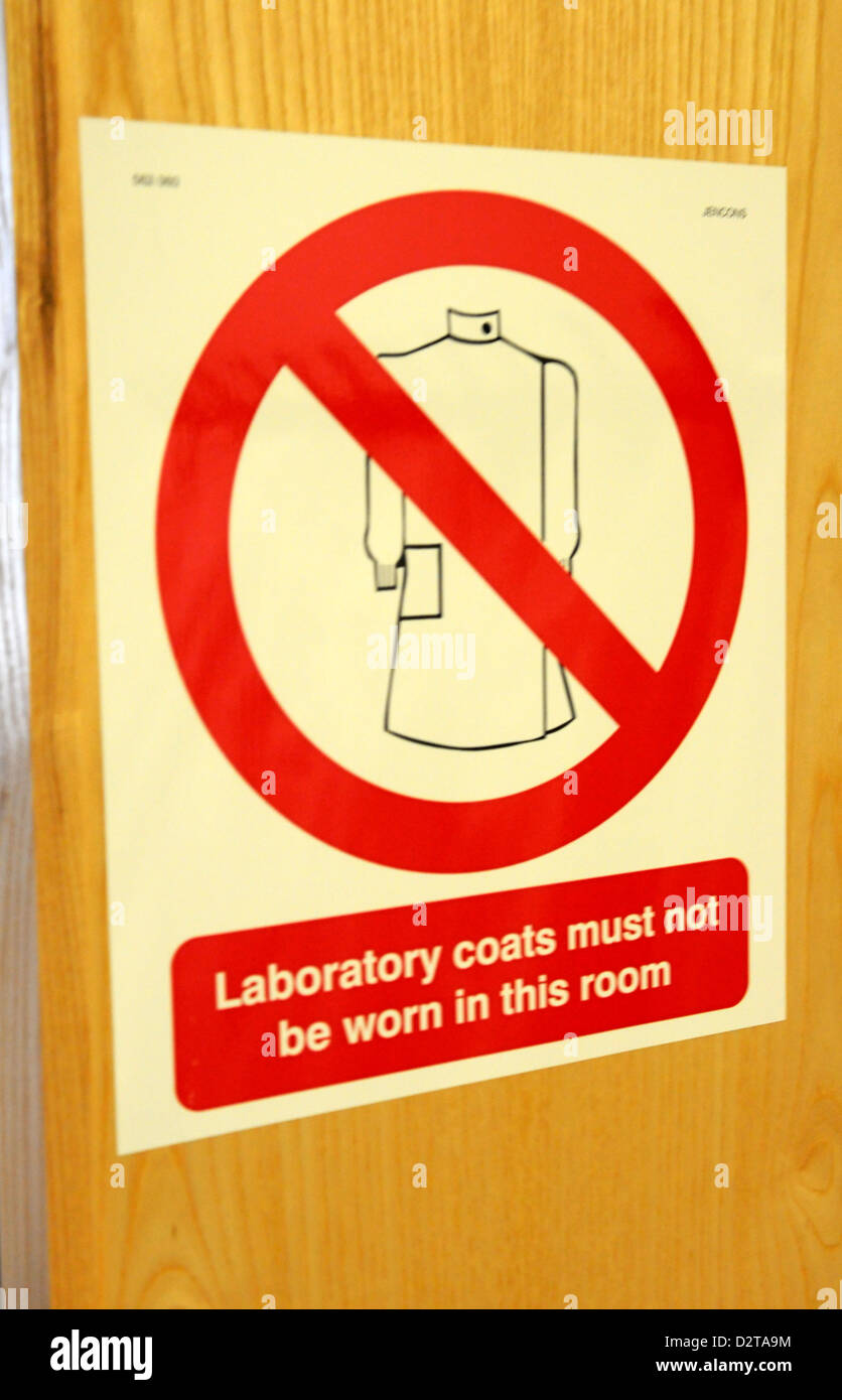 Laboratory coats must not be worn in this room sign on a door of a