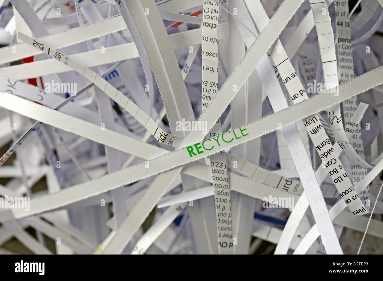 Close-up of shredded paper with the focus on the word 'RECYCLE' Stock Photo