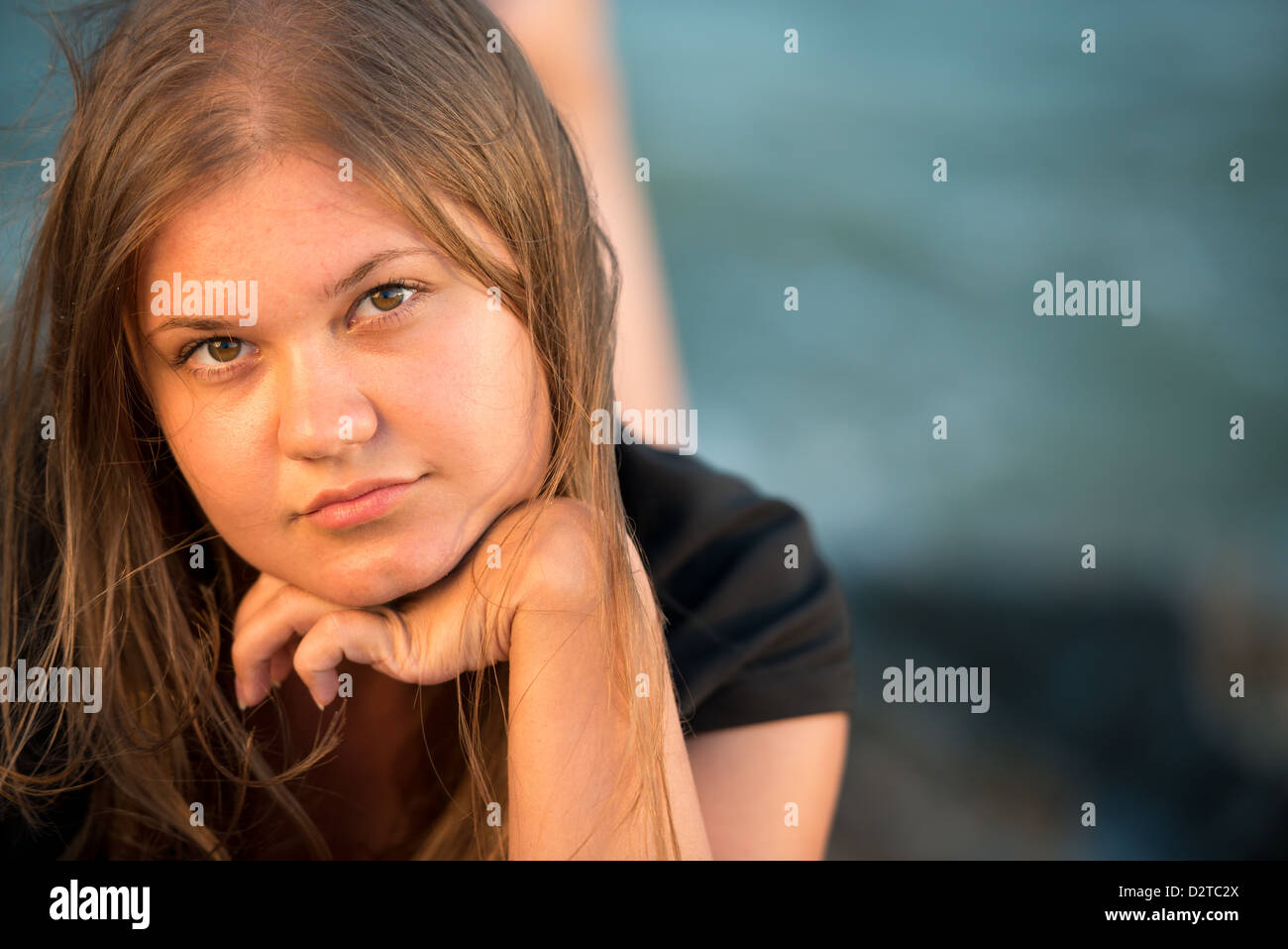 beautiful brunette girl with long hair wearing black dress Stock Photo ...
