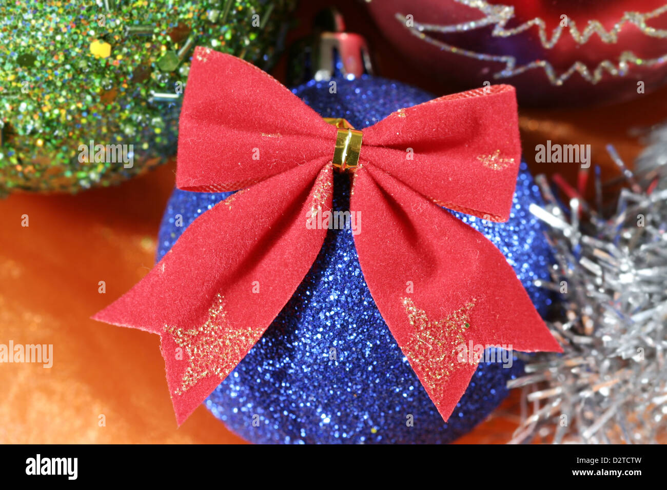 Christmas ball  on orange background. Stock Photo