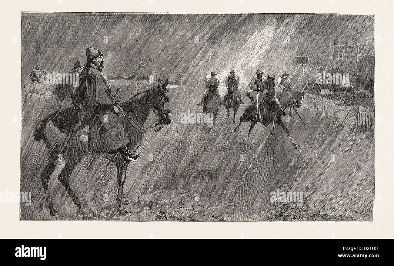 THE NEWMARKET OCTOBER MEETING: RAIN ON THE COURSE: A GOOD WETTING-THROUGH FOR THE JOCKEYS Stock Photo