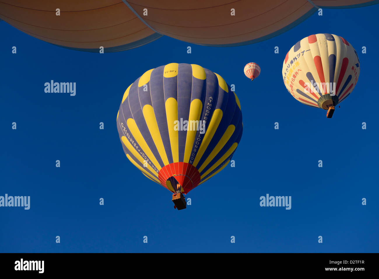 View of overhead hot air balloons and flame from propane heater in Cappadocia Turkey Stock Photo