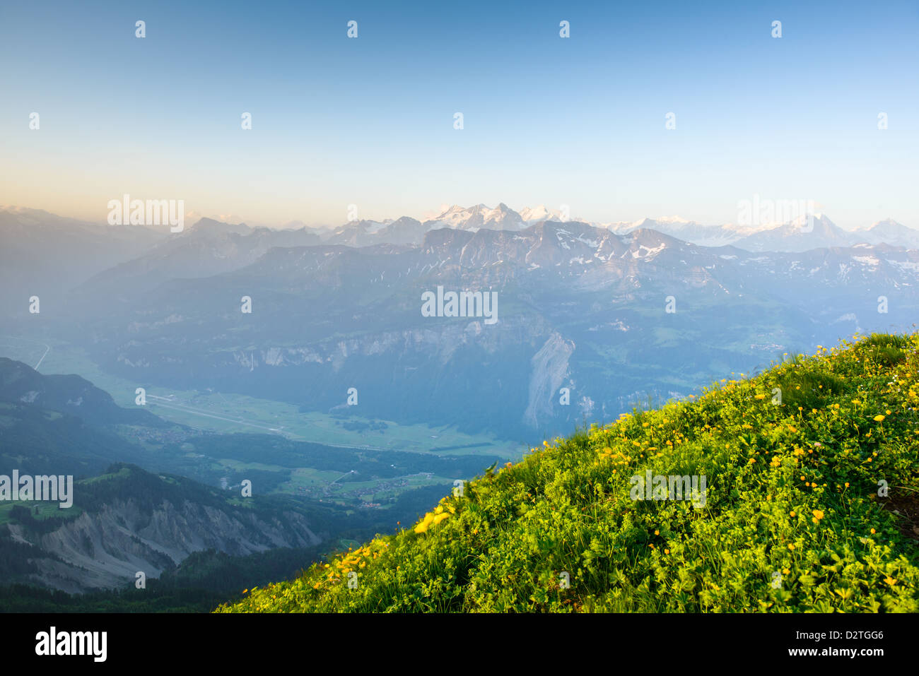 Mountain panorama from Brienzer Rothorn with green meadow and blue sky Stock Photo