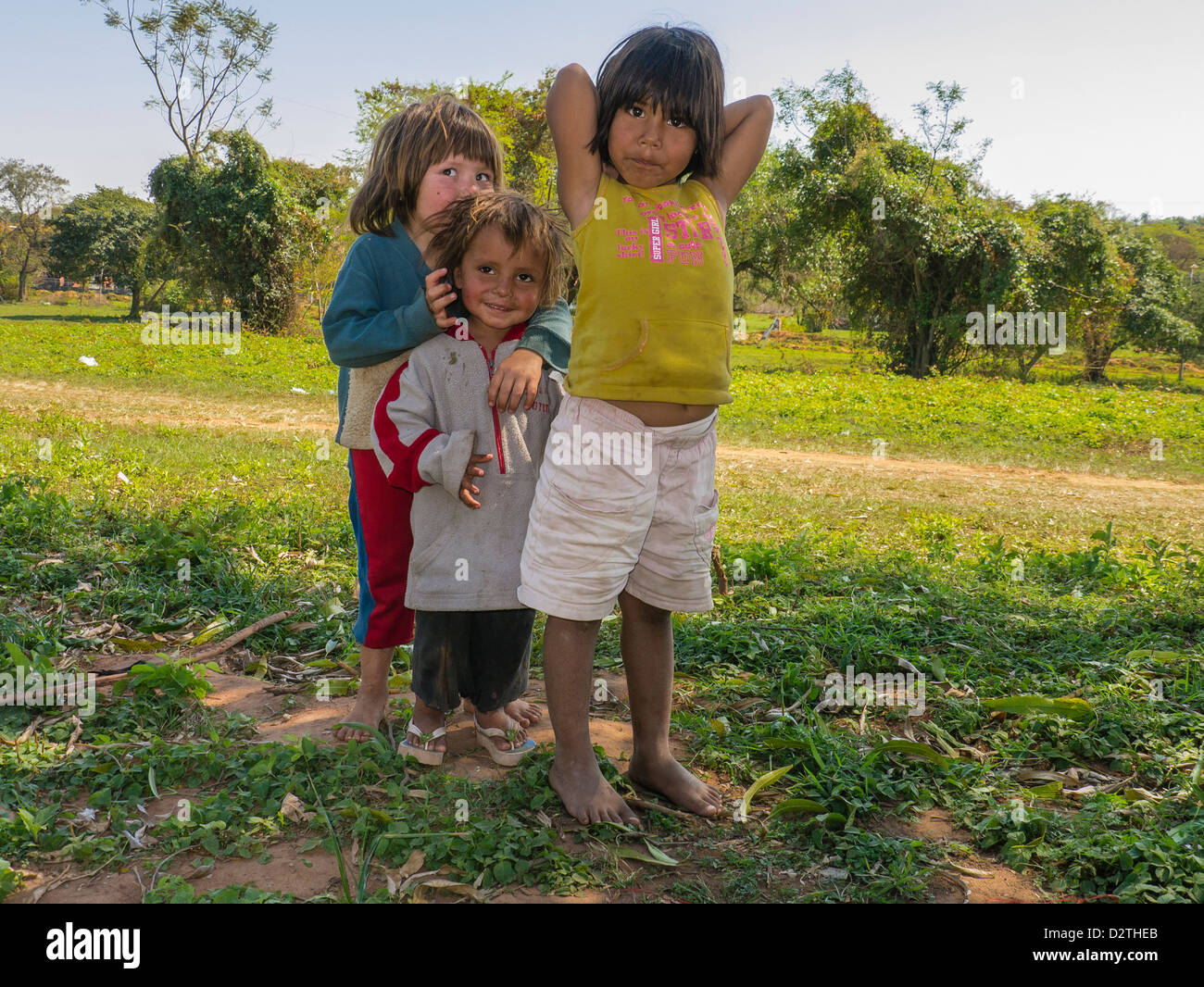 Young Paraguayan Hispanic girls who are hanging out by a Habitat for Humanity home building project/ Stock Photo