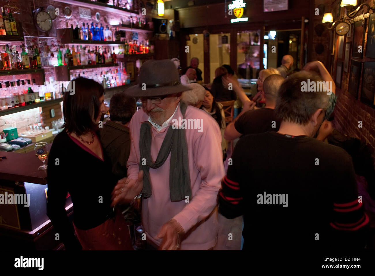 Istanbul, Turkey, the owner of a pub makes its way through dancing ...