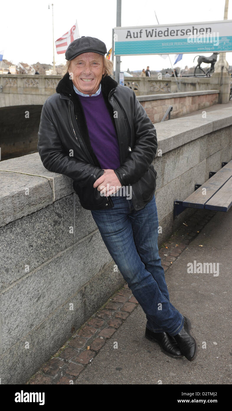 dpa-exclusive: German actor Claus Theo Gaertner smiles as he stands on a bridge in front of the Les Trois Rois hotel prior to an interview with German news agency dpa in Basel, Switzerland, 31 January 2013. Photo: Uli Deck Stock Photo